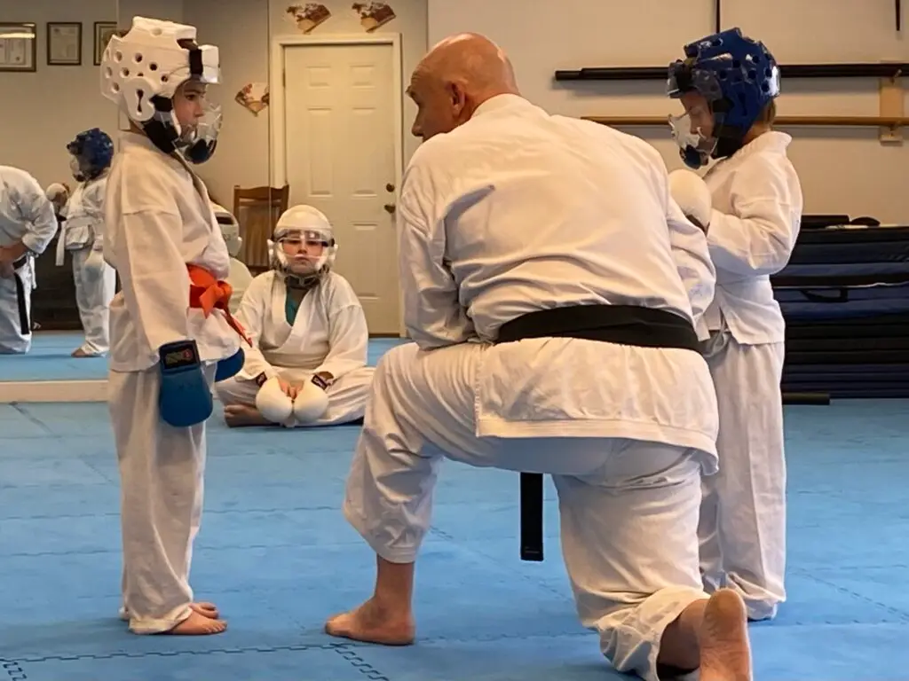 Image of Charlestown, Indiana Shotokan Karate providing advice to students before an exercise.