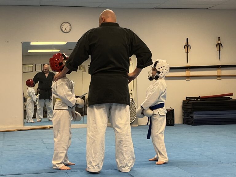 Image of Charlestown, Indiana Shotokan Karate Sensei teaching students about to practice.