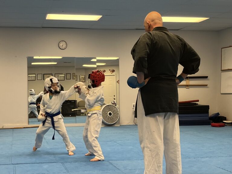 Image of Charlestown, Indiana Shotokan Karate Sensei wathcing his students practice.